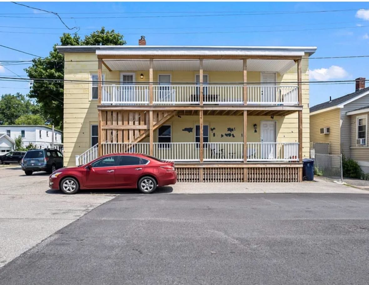 Restored multi-unit home with rebuilt porches
