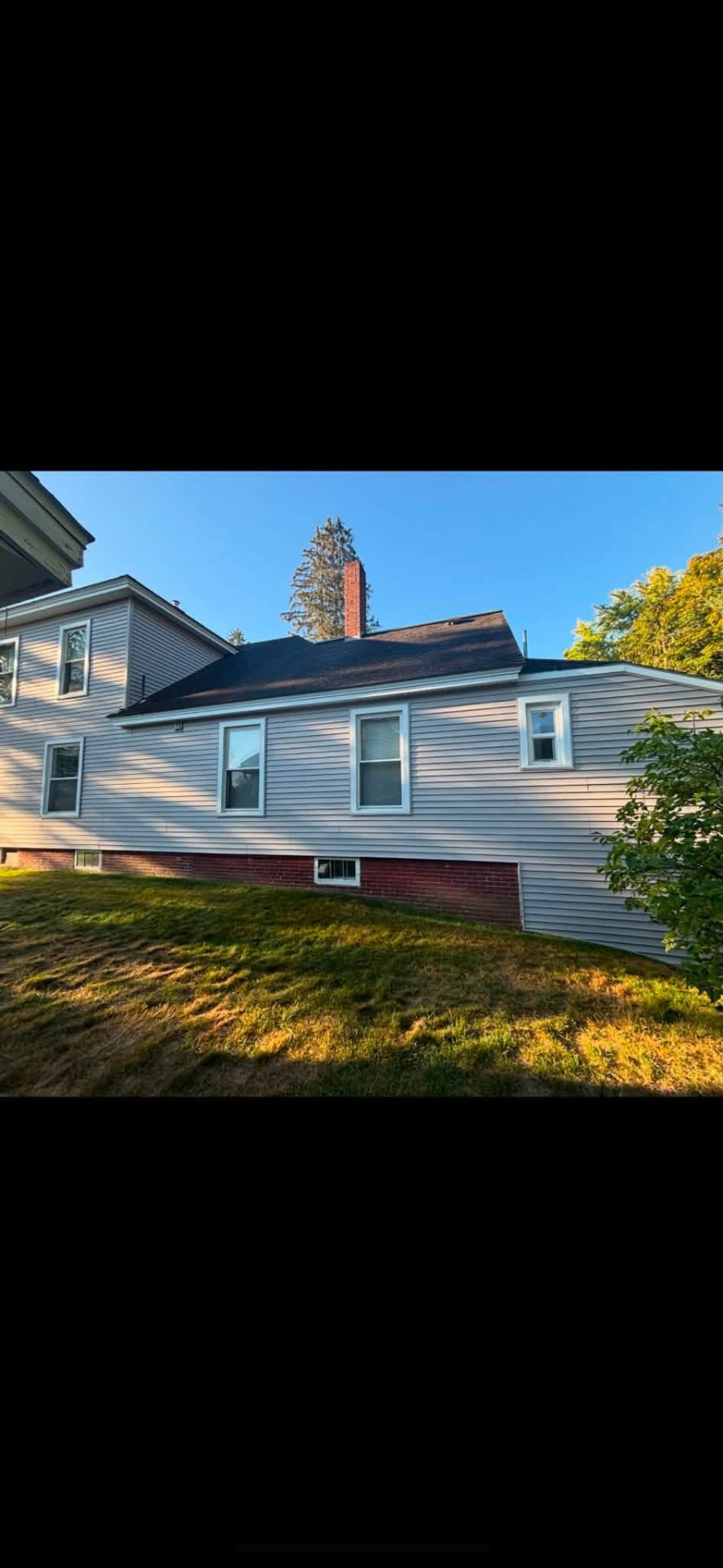Home with clean white siding and freshly trimmed windows