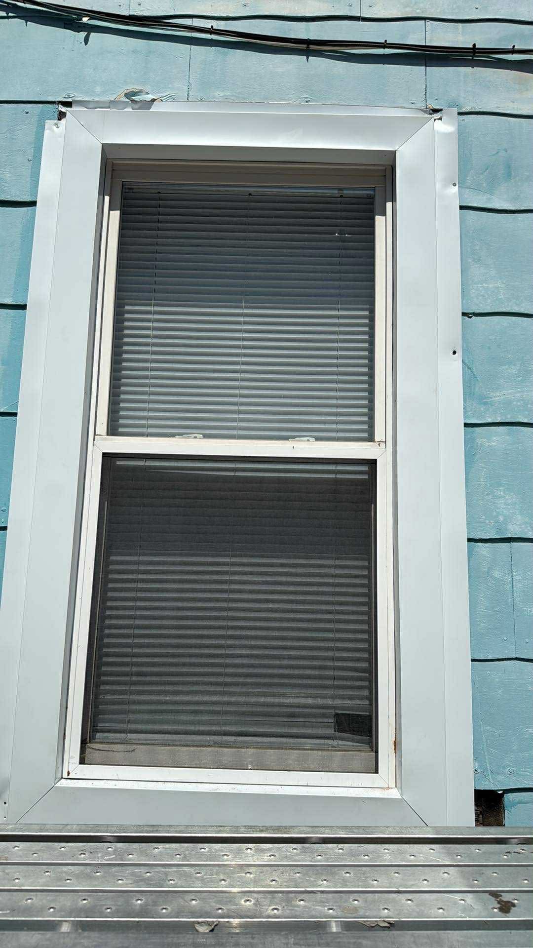 New window with clean white aluminum trim wrap